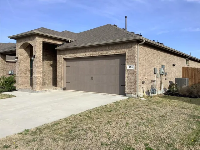 a front view of a house with a garage