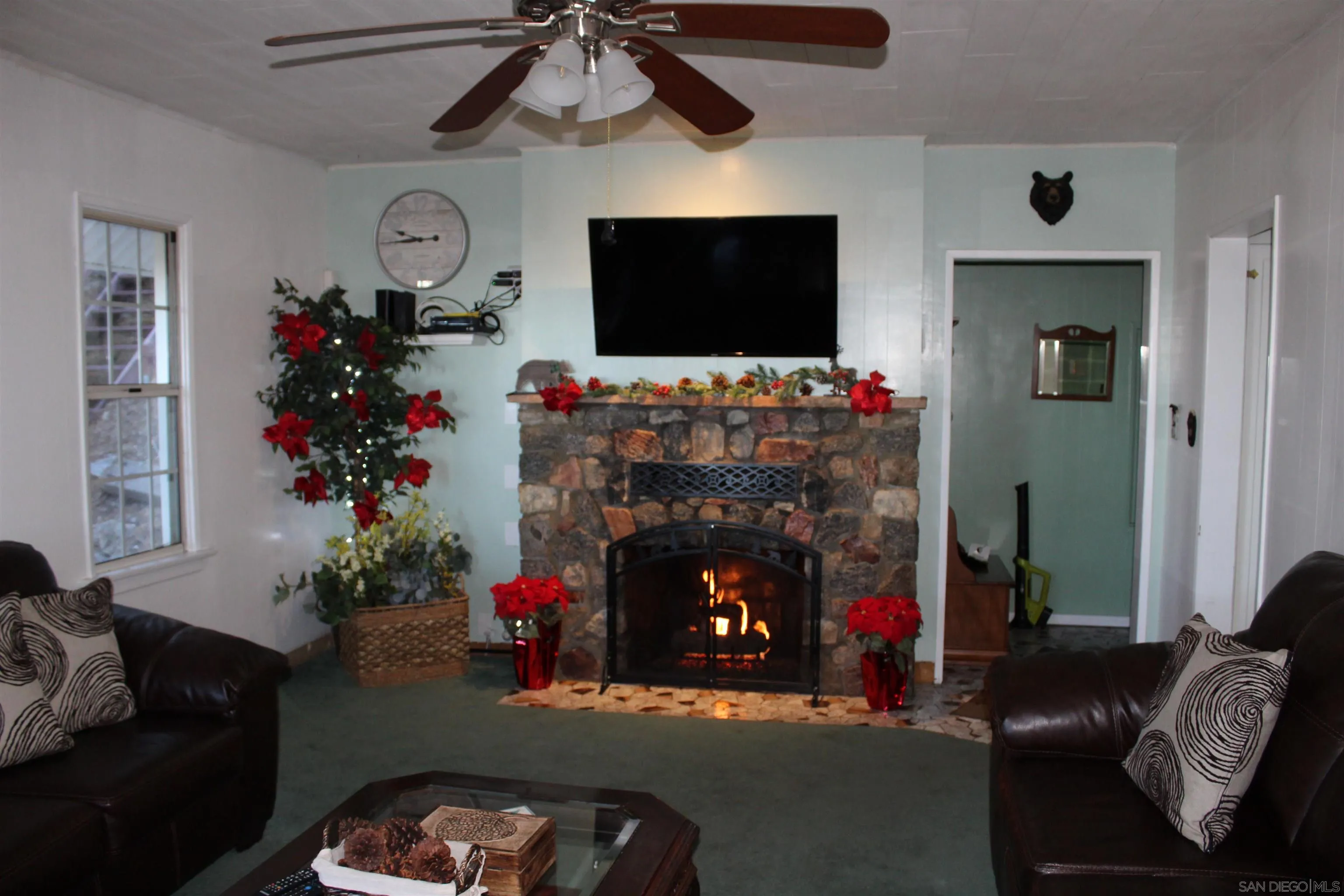 23984 Skyland Drive Crestline, CA 92325 - Photo 3 of 35 a living room with furniture and a flat screen tv