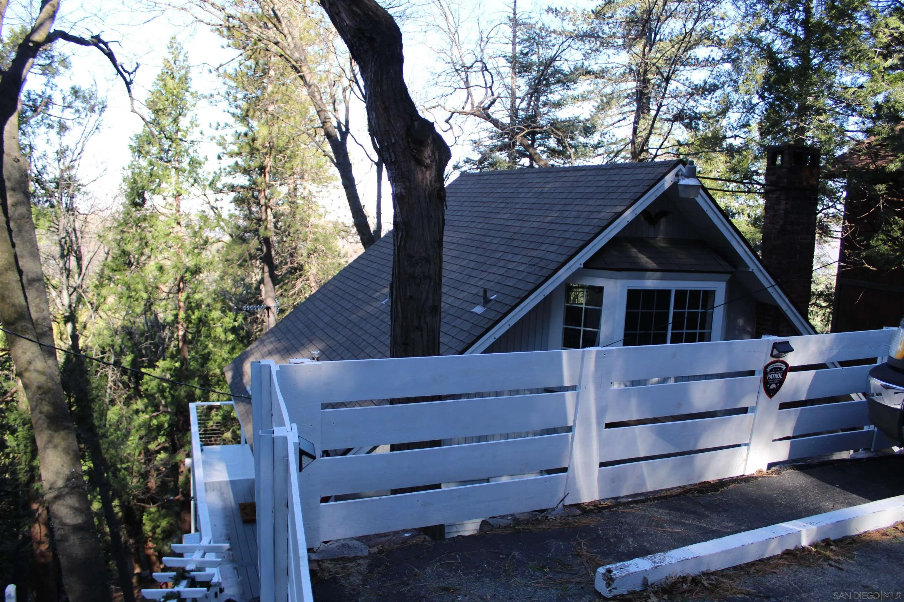 23984 Skyland Drive Crestline, CA 92325 - Photo 34 of 35 a front view of a house with a yard