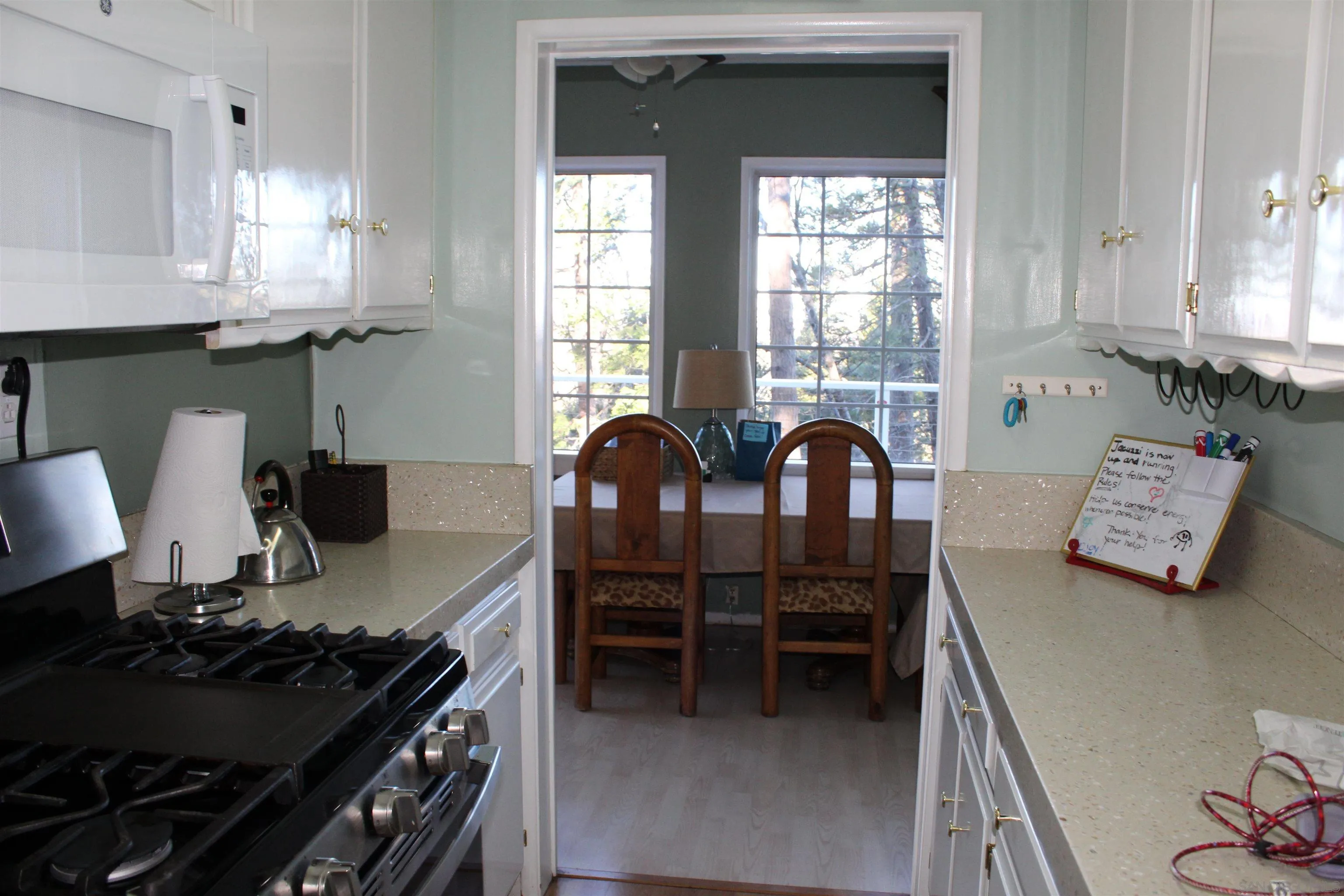 23984 Skyland Drive Crestline, CA 92325 - Photo 5 of 35 a kitchen with a stove and a window
