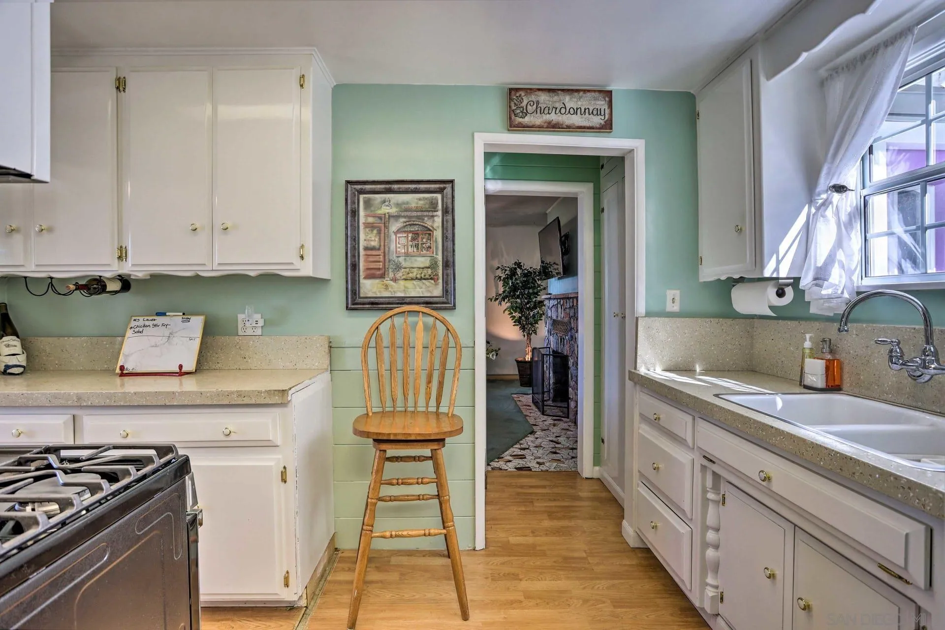 23984 Skyland Drive Crestline, CA 92325 - Photo 6 of 35 a kitchen with stainless steel appliances granite countertop a stove and a sink