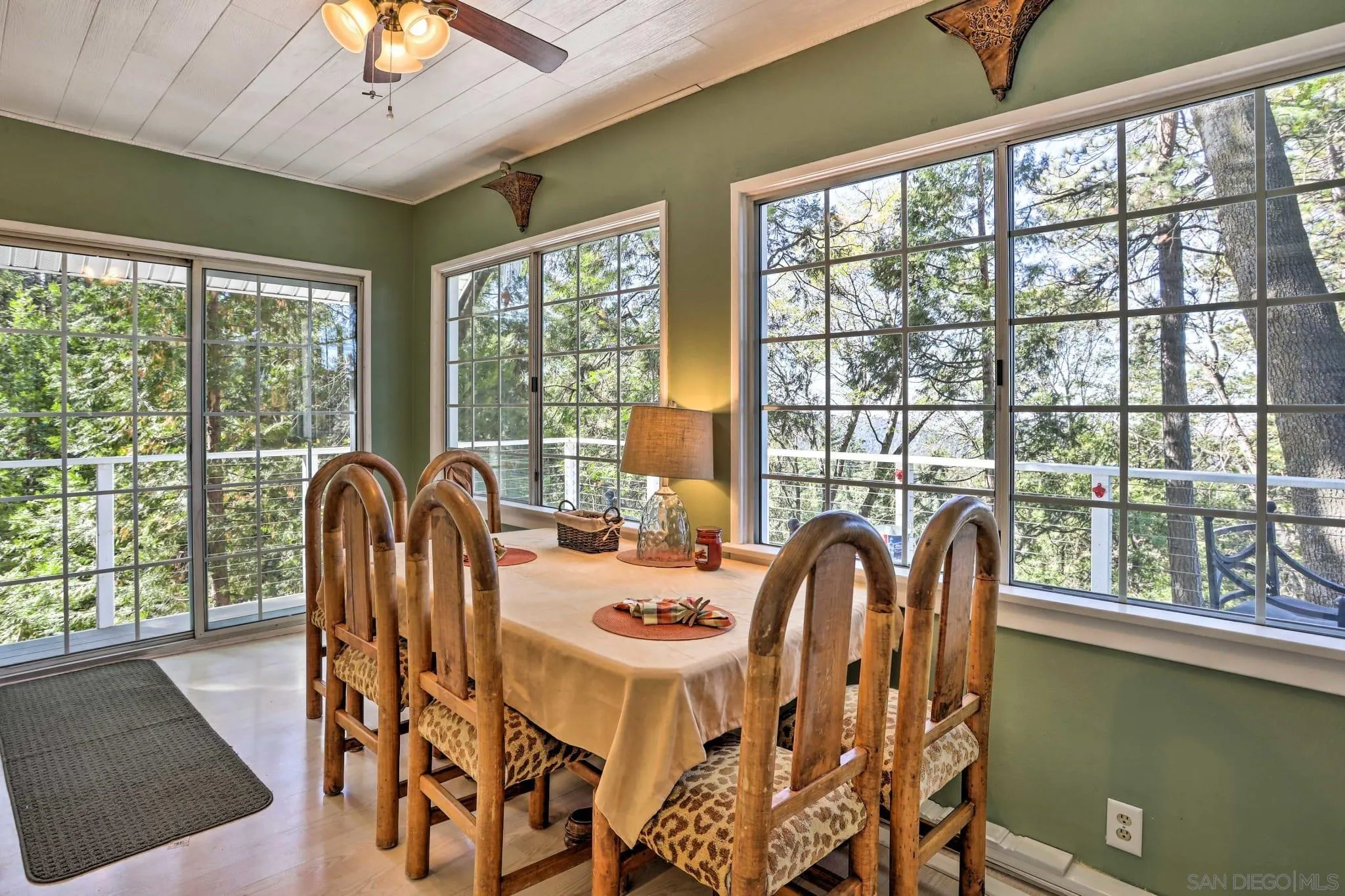 23984 Skyland Drive Crestline, CA 92325 - Photo 8 of 35 a view of a dining room with furniture window and outside view