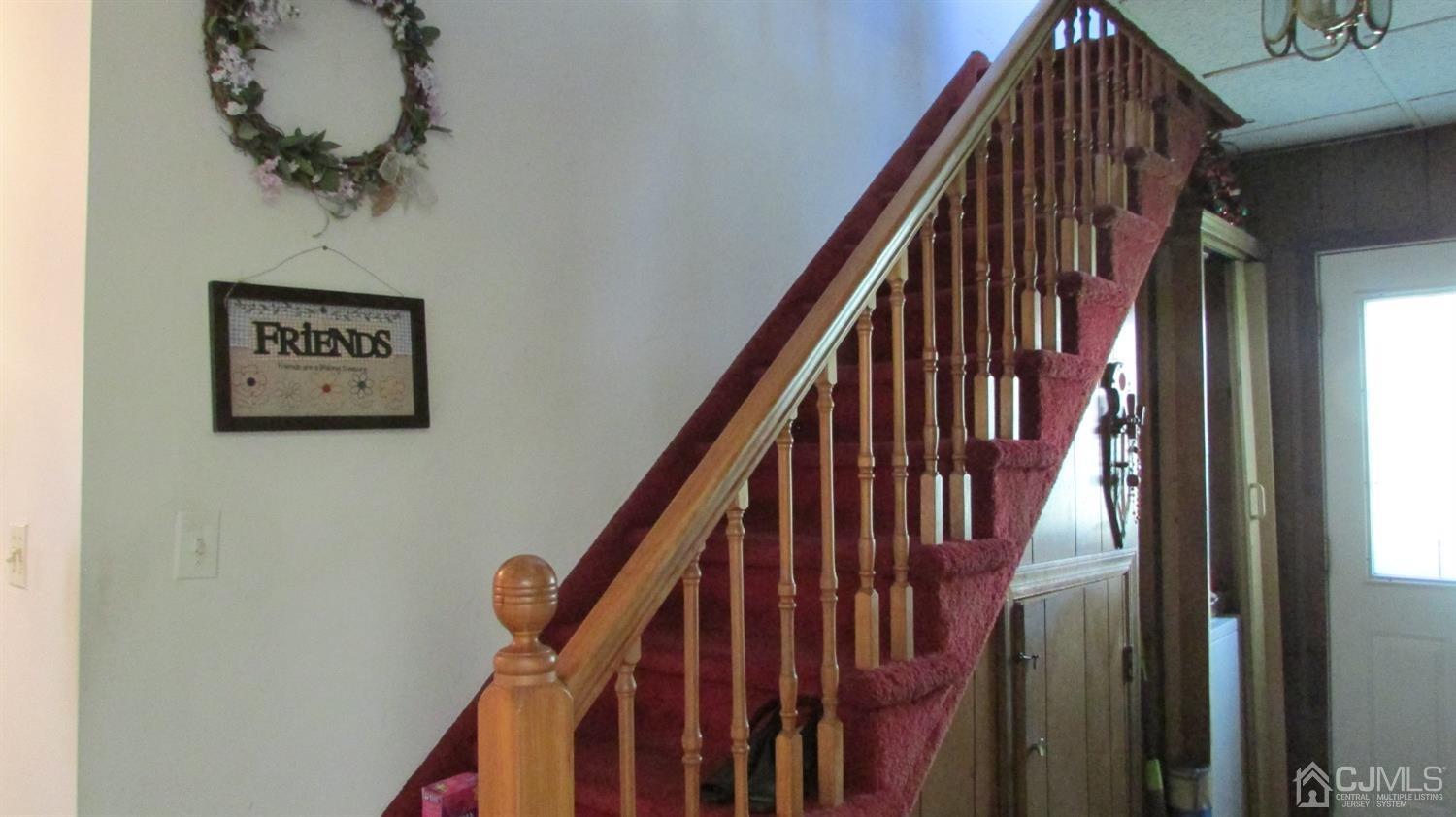 19 Hillsdale Road Edison, NJ 08820 - Photo 11 of 13 a view of staircase with wooden floor and white walls