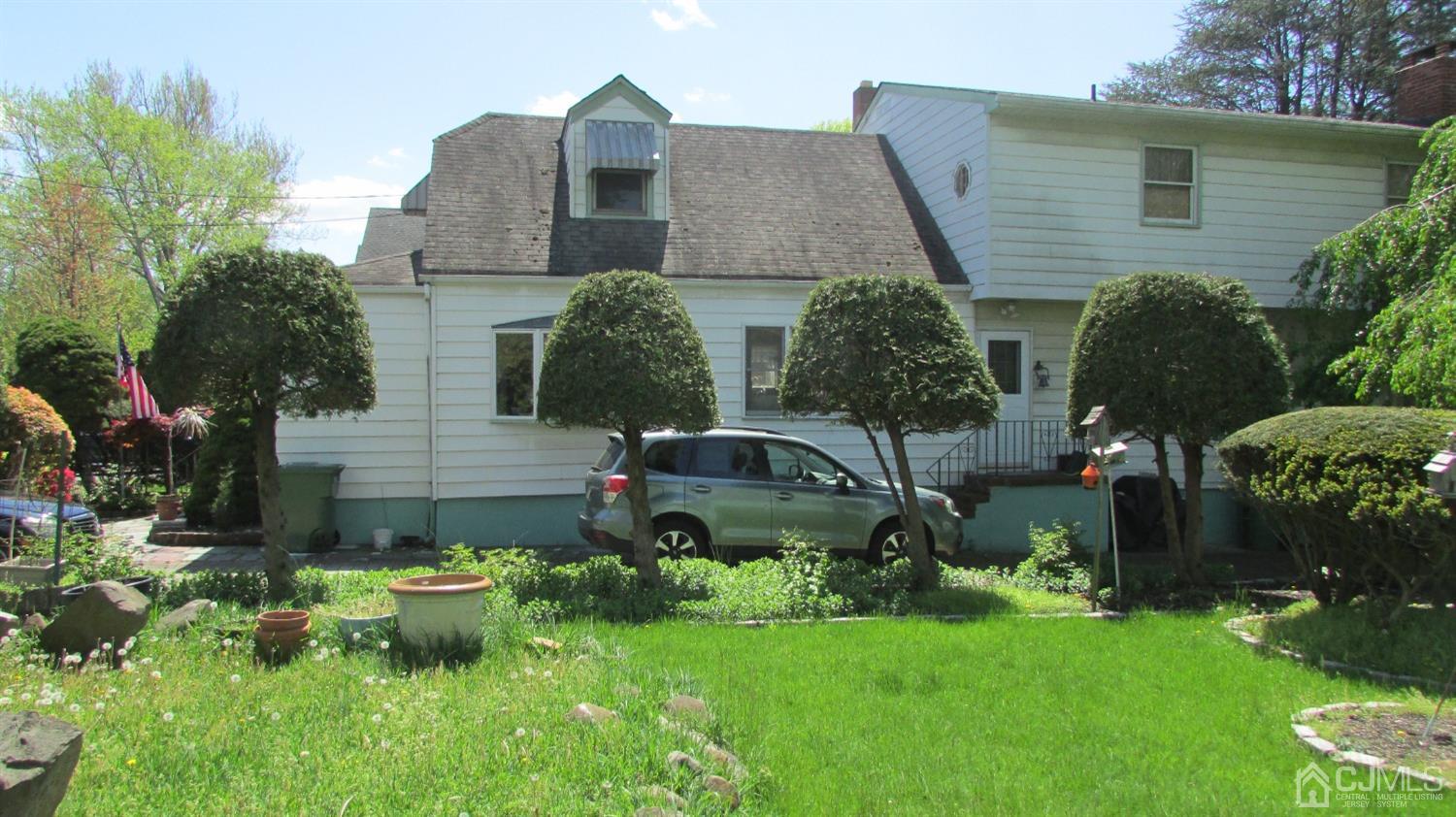19 Hillsdale Road Edison, NJ 08820 - Photo 3 of 13 a view of a house with a yard and sitting area