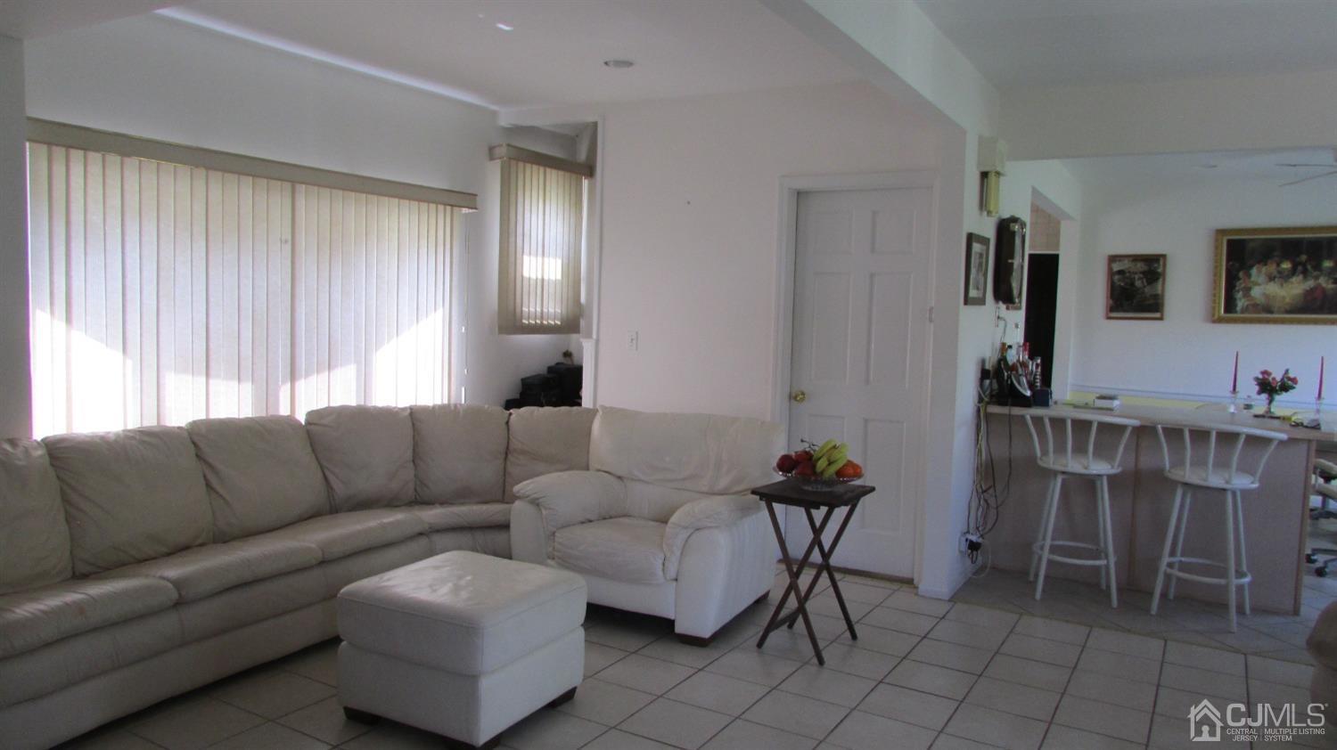19 Hillsdale Road Edison, NJ 08820 - Photo 6 of 13 a living room with furniture and a window