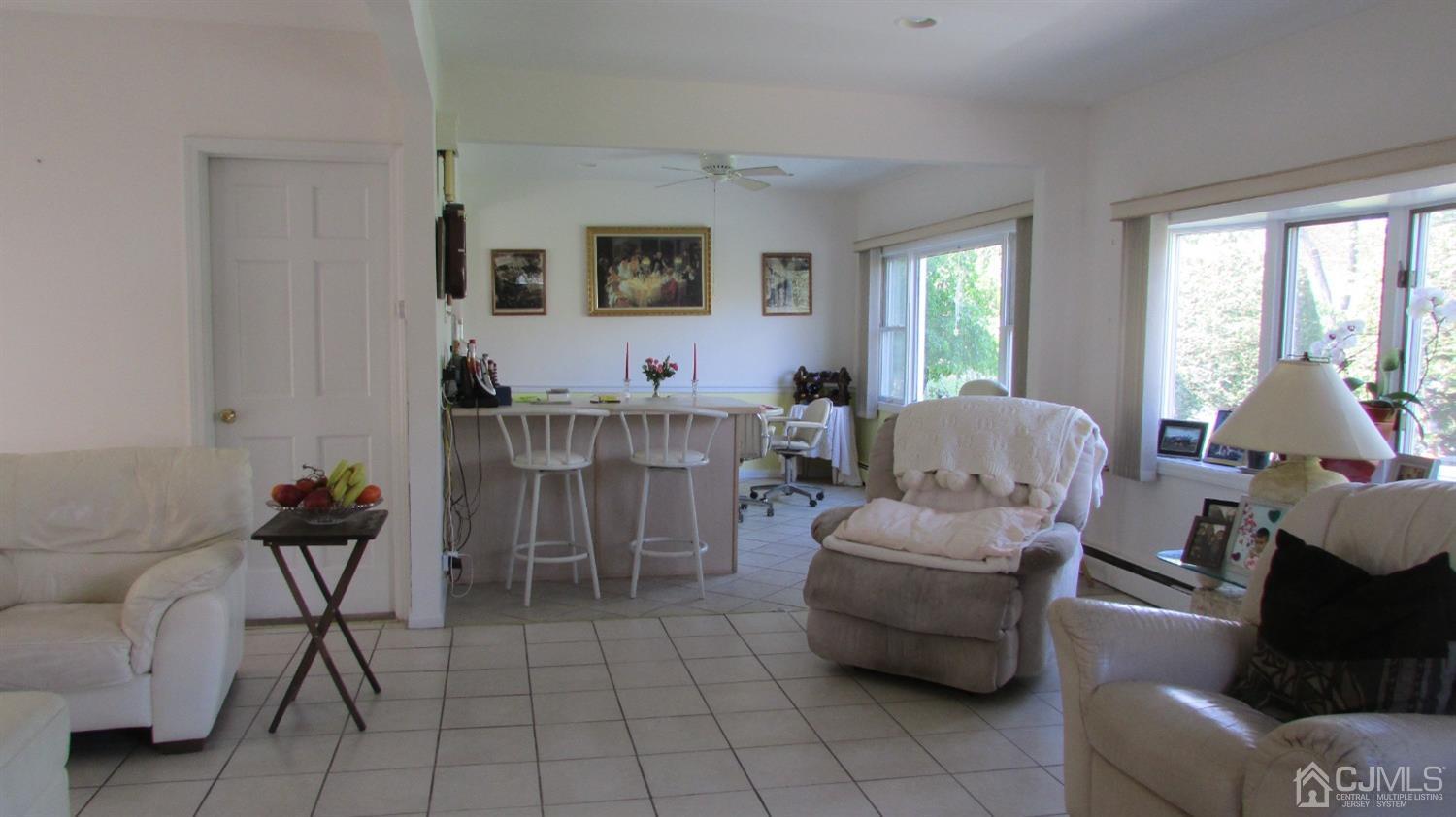 19 Hillsdale Road Edison, NJ 08820 - Photo 7 of 13 a living room with furniture and a window