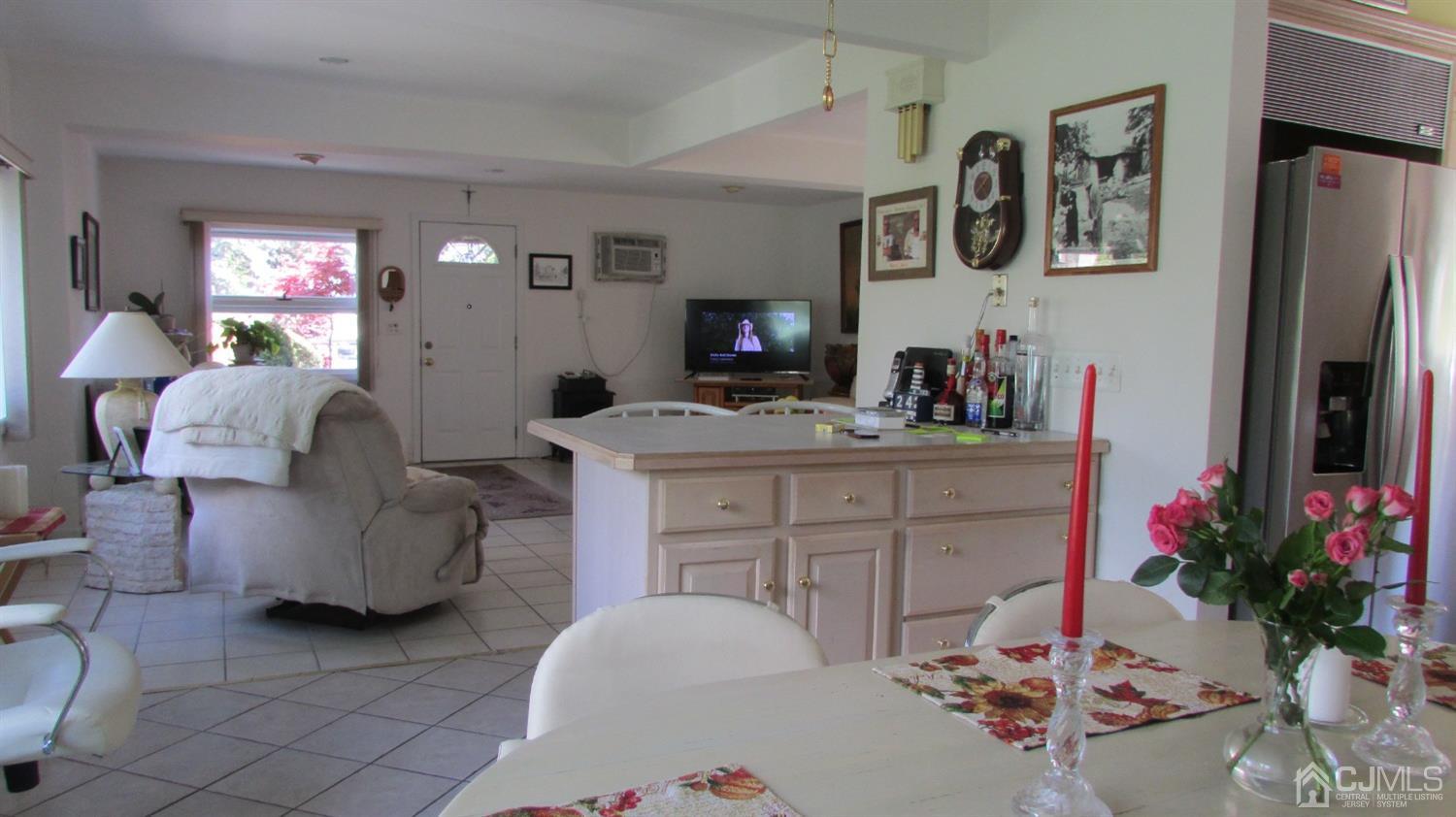 19 Hillsdale Road Edison, NJ 08820 - Photo 10 of 13 a living room with furniture and a flat screen tv