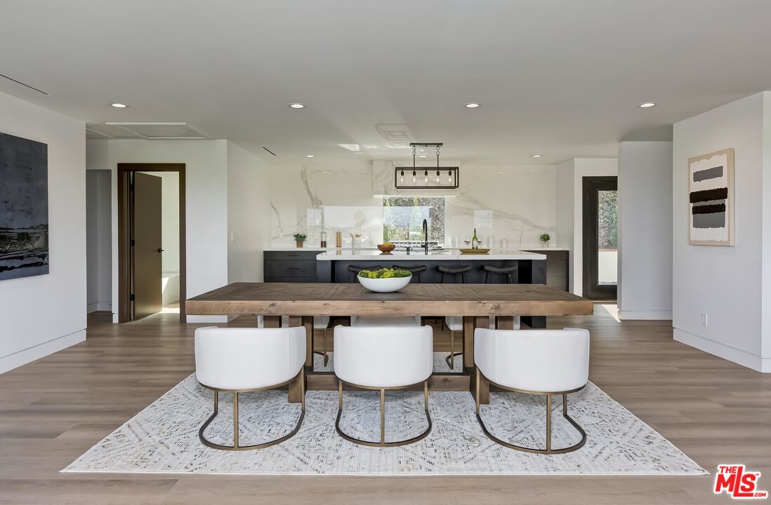5236 Sanchez Drive Los Angeles, CA 90008 - Photo 12 of 32 a kitchen with a dining table and chairs