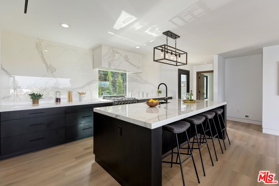 5236 Sanchez Drive Los Angeles, CA 90008 - Photo 14 of 32 a kitchen with a table and chairs in it