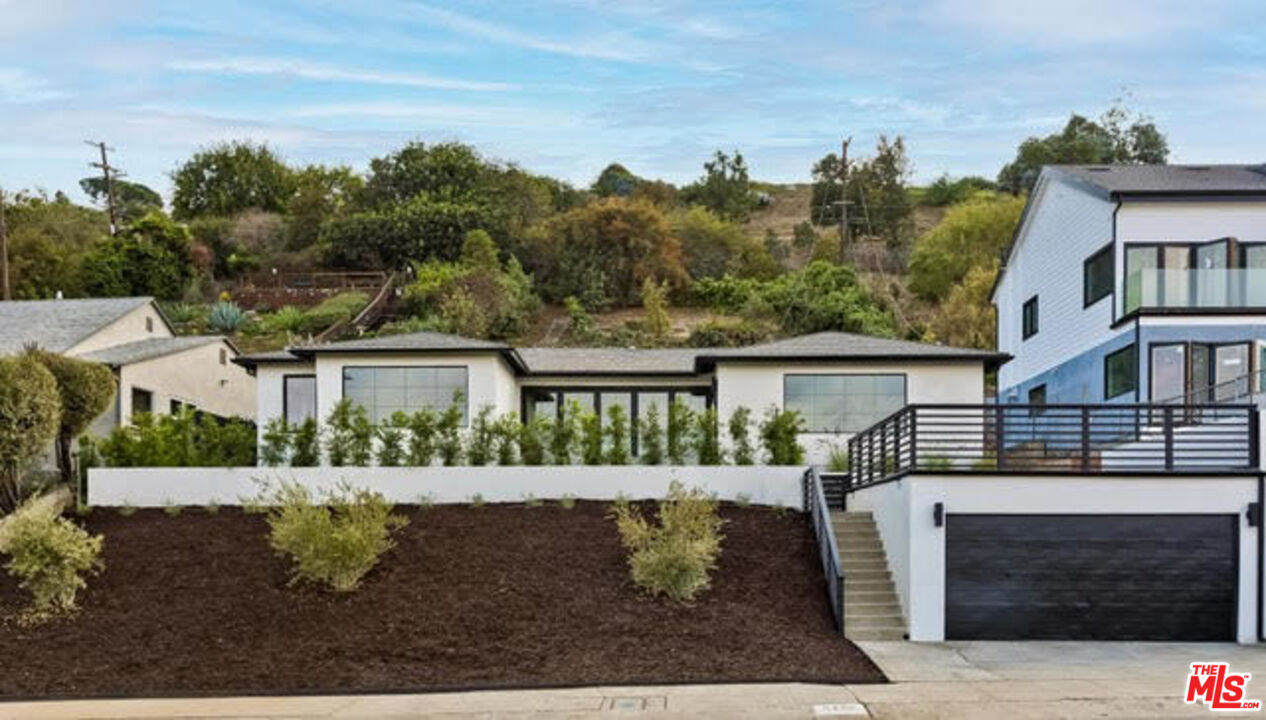 5236 Sanchez Drive Los Angeles, CA 90008 - Photo 2 of 32 a view of a house with a yard