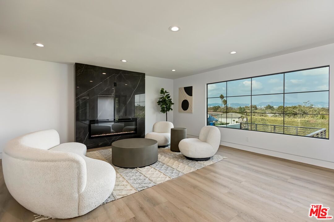 5236 Sanchez Drive Los Angeles, CA 90008 - Photo 4 of 32 a living room with furniture and a large window