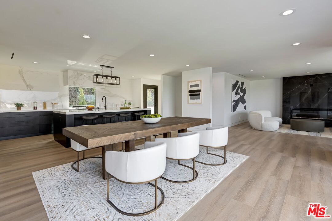 5236 Sanchez Drive Los Angeles, CA 90008 - Photo 7 of 32 a living room with furniture a rug and a flat screen tv