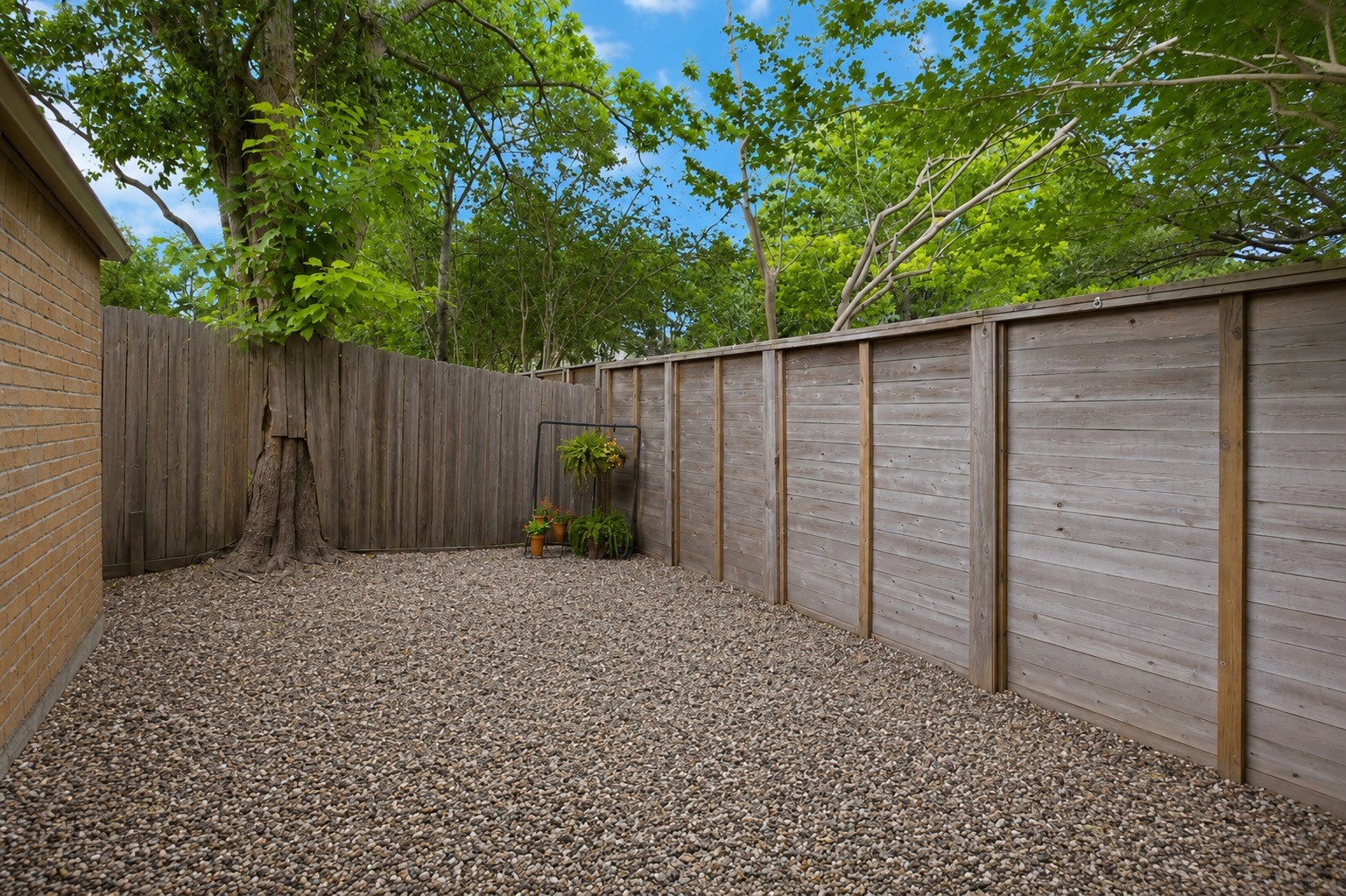 619 Rancho Bauer Drive Houston, TX 77079 - Photo 40 of 46 A courtyard by the garage can be a perfect space for a cozy sitting area, outdoor entertaining, or even a playground for kids.