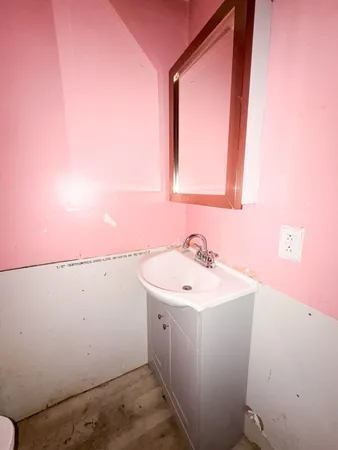a bathroom with a bathtub and shower