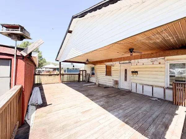 a view of a backyard with sitting area