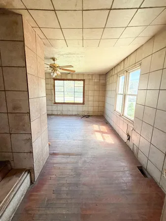 a view of empty room with windows