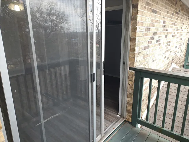 a bathroom with a glass shower door
