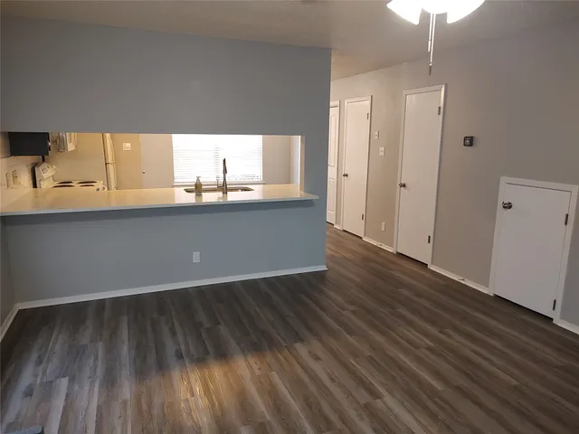 a view of kitchen and wooden floor