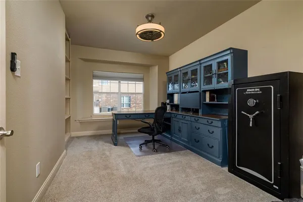 a view of workspace with furniture and window