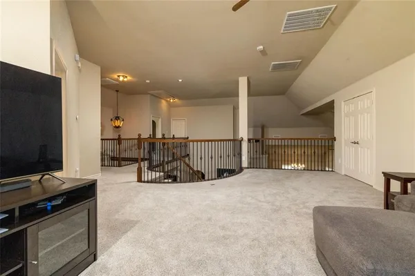 a view of a livingroom with furniture and flat screen tv