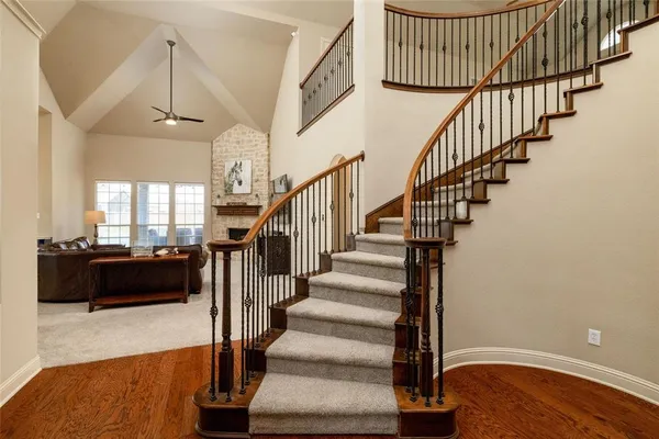 a view of entryway and hall with wooden floor