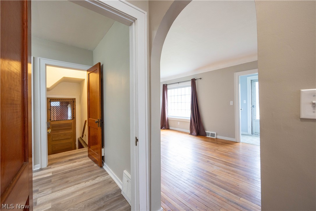 14474 Pease Road Maple Heights, OH 44137 - Photo 12 of 50 Hallway featuring light hardwood / wood-style flooring
