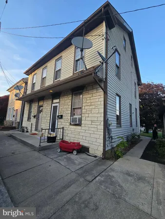 a front view of a house with a garage