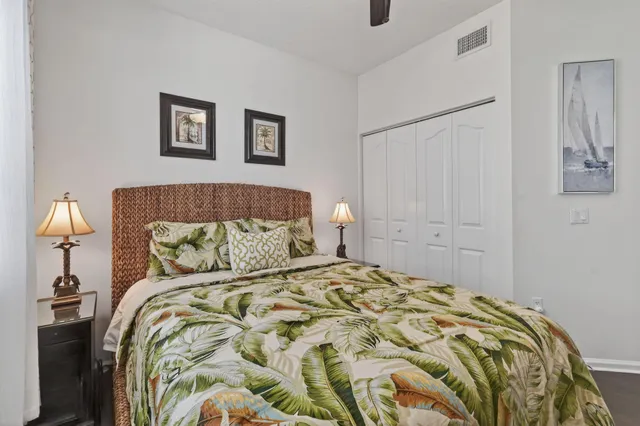 a bedroom with a bed and a night stand