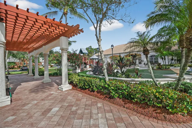 a view of a backyard with potted plants