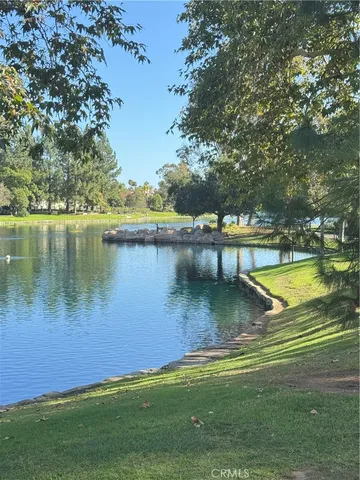a view of a water pond with lots of green space