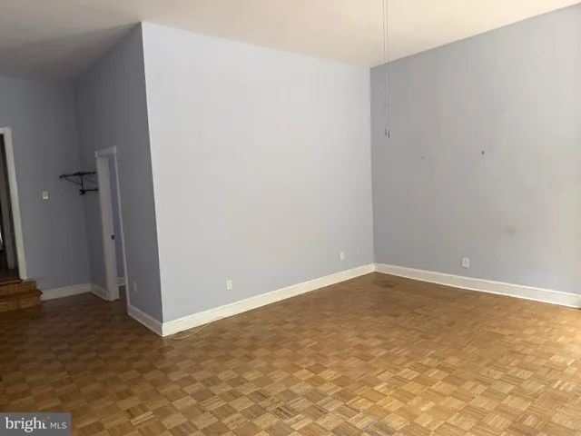 a living room with furniture a lamp and a lamp