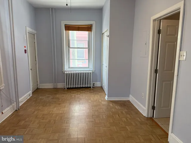 a view of an empty room with stairs