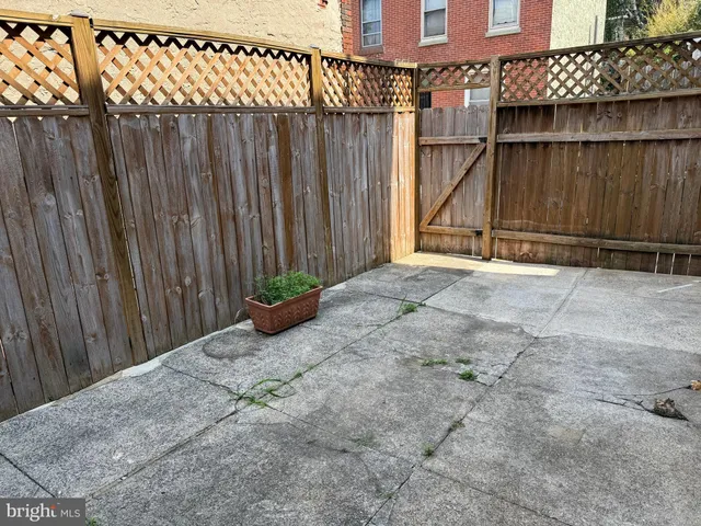 a view of a chairs and table in the patio