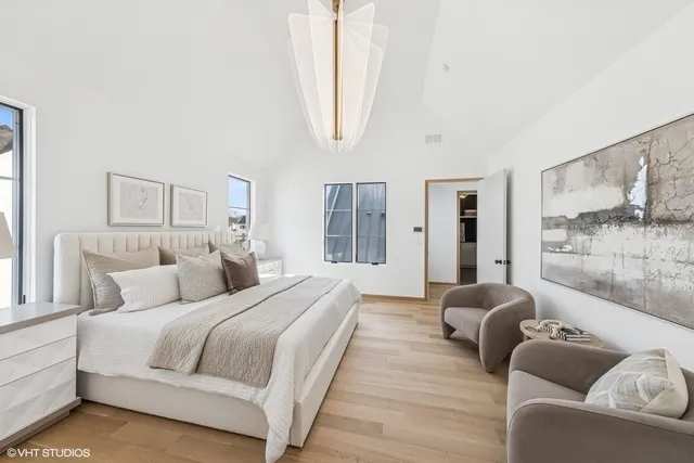 a bedroom with a large bed and a couch