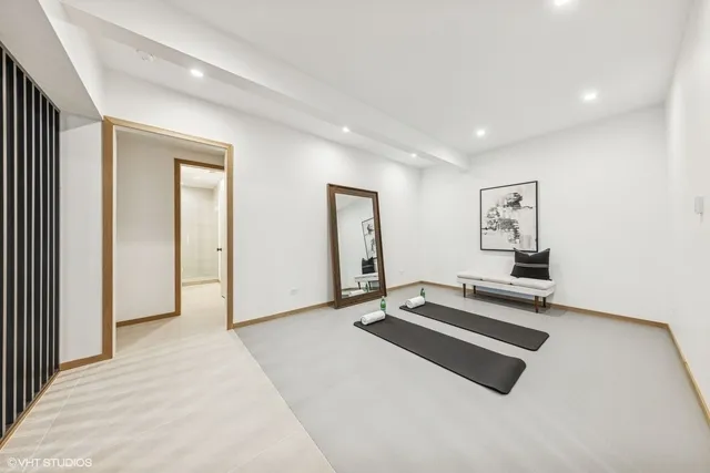 a room with gym equipment and mirror
