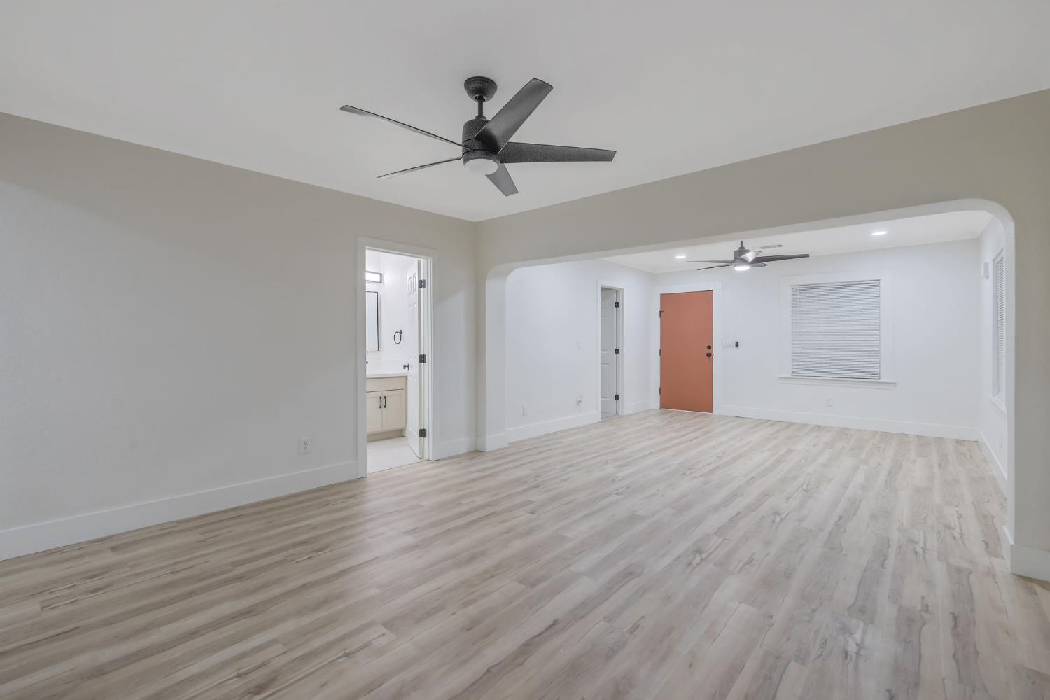1402 Middleton Street Hanford, CA 93230 - Photo 14 of 40 a view of empty room with wooden floor and ceiling fan