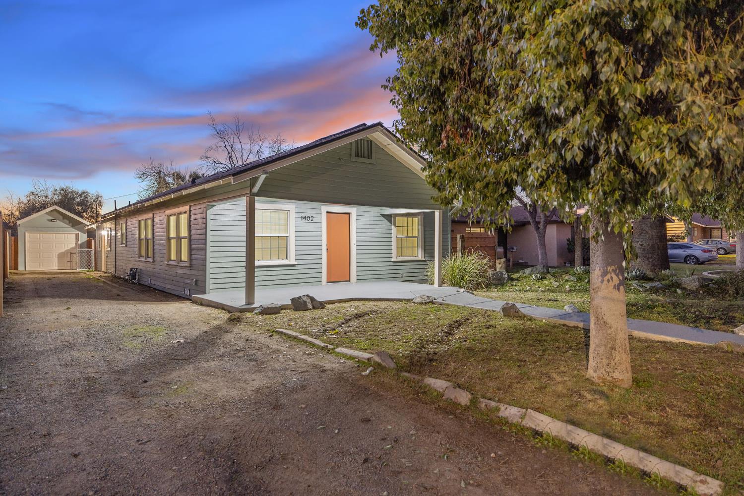 1402 Middleton Street Hanford, CA 93230 - Photo 2 of 40 a house with trees in front of it