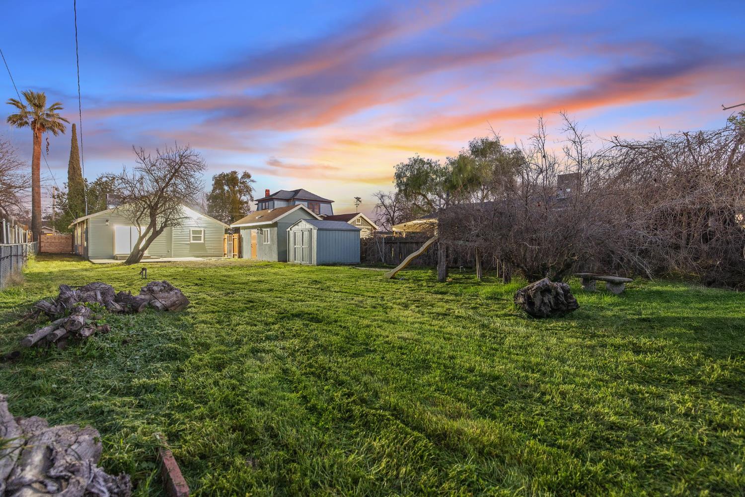 1402 Middleton Street Hanford, CA 93230 - Photo 36 of 40 a view of a garden with a house in the background
