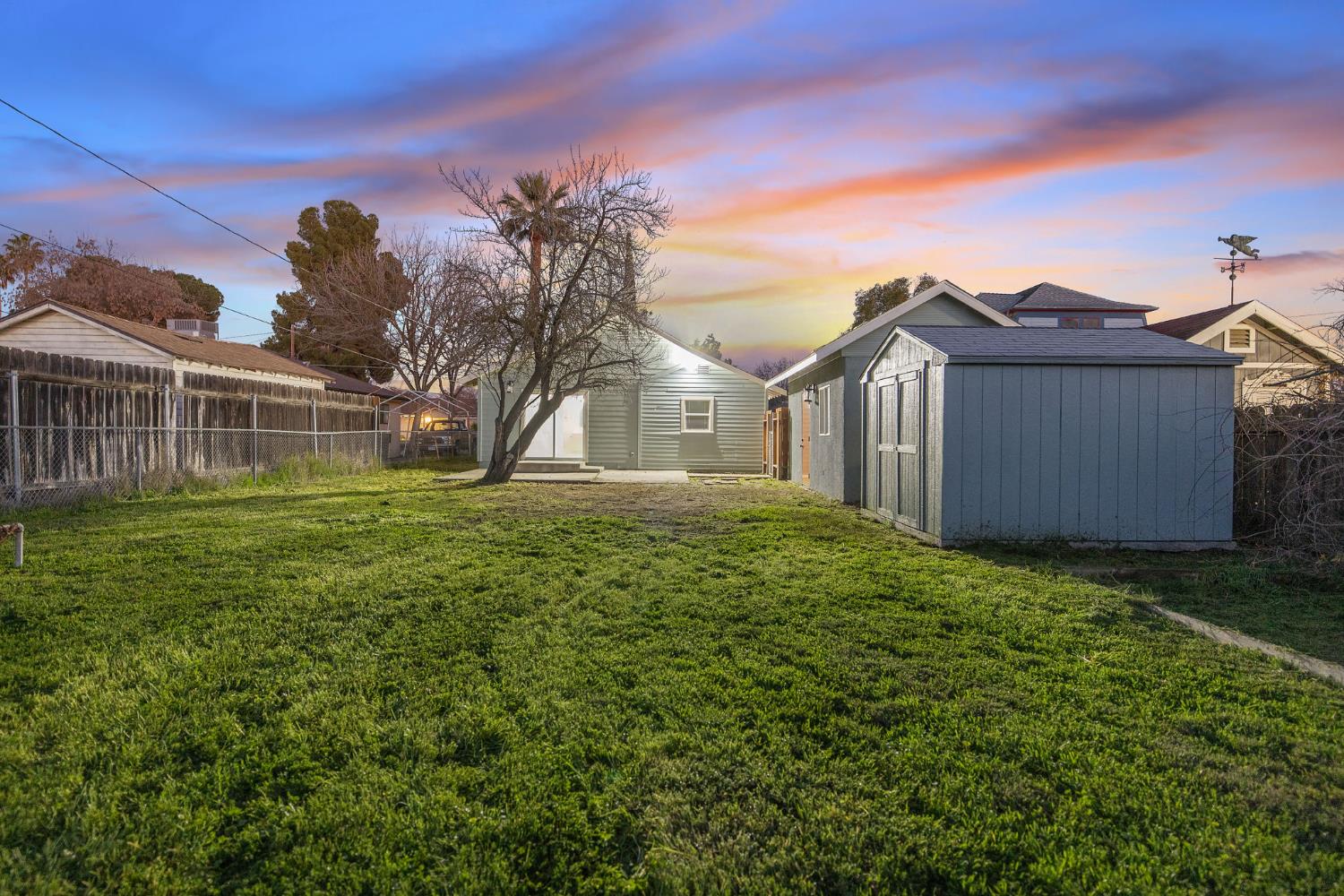 1402 Middleton Street Hanford, CA 93230 - Photo 37 of 40 a view of a big yard with a house in the background