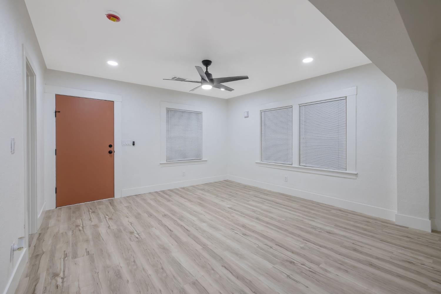 1402 Middleton Street Hanford, CA 93230 - Photo 5 of 40 a view of an empty room with wooden floor