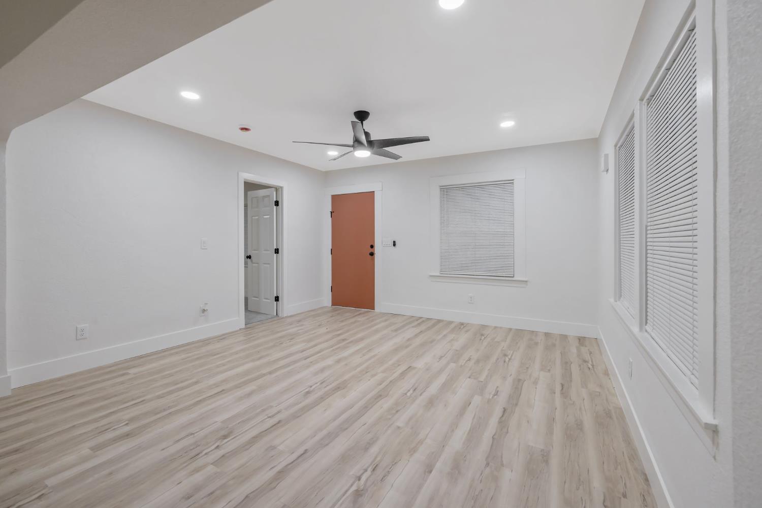 1402 Middleton Street Hanford, CA 93230 - Photo 6 of 40 wooden floor in an empty room with a window