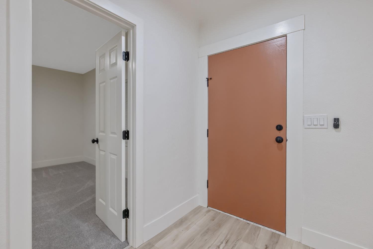 1402 Middleton Street Hanford, CA 93230 - Photo 7 of 40 a view of a hallway with wooden floor
