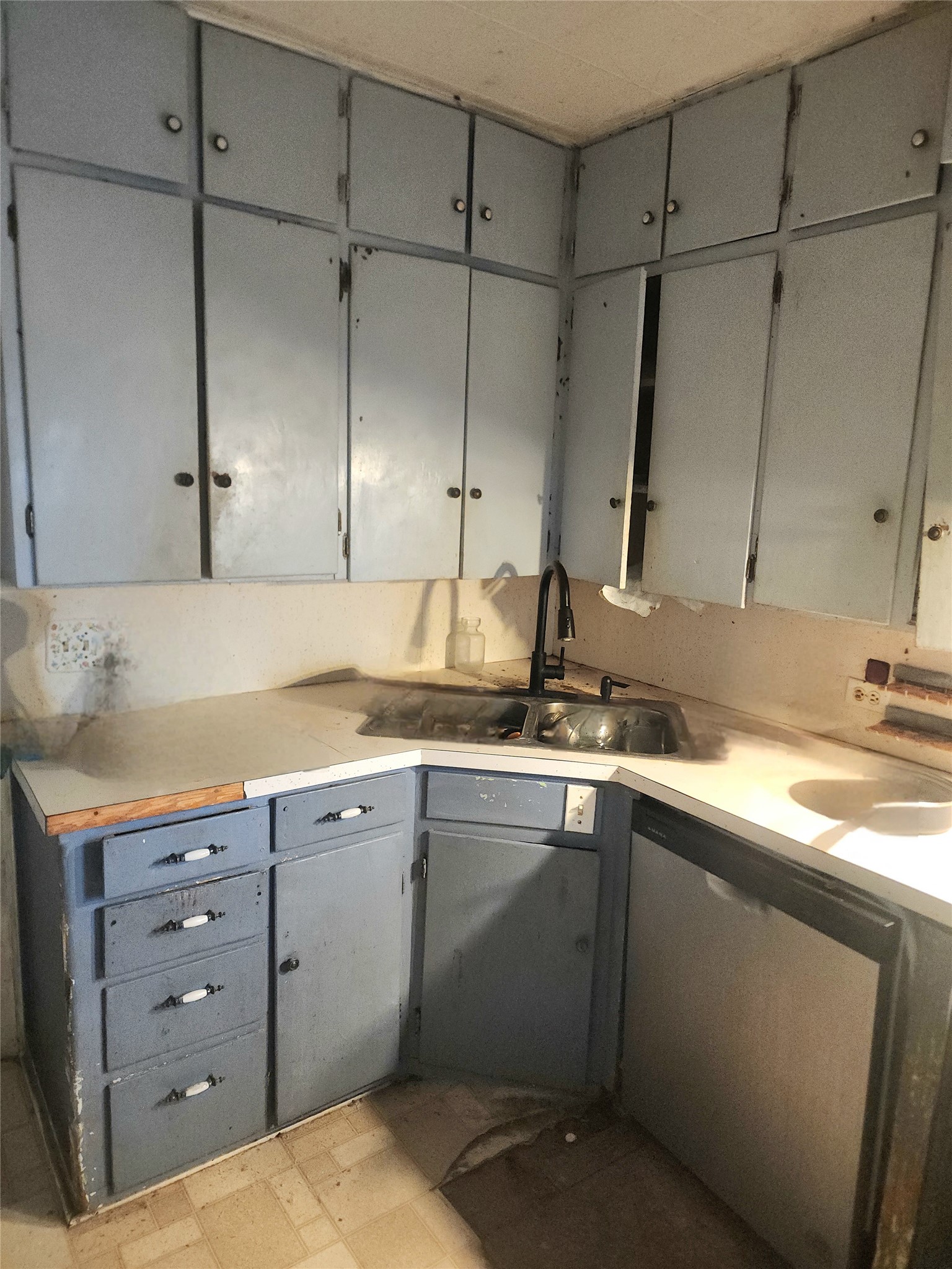 702 Maple Street Yoakum, TX 77995 - Photo 5 of 7 a kitchen with a sink and cabinets