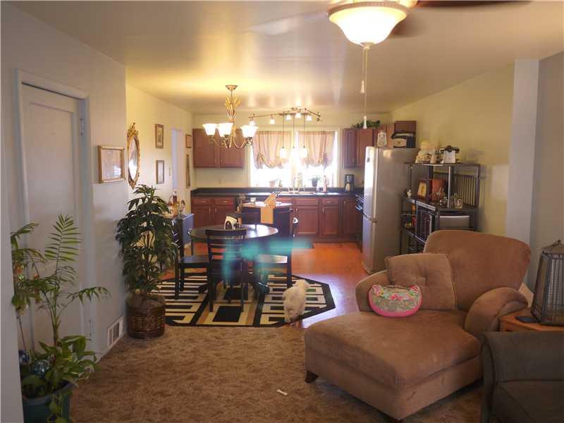 926 Beaver Road Ambridge, PA 15003 - Photo 5 of 13 Dining Room. A view of the Kitchen and Dining Area from the Living room showing how open and airy this living area is. The wonderful black shelving in the dining will stay with the home.
