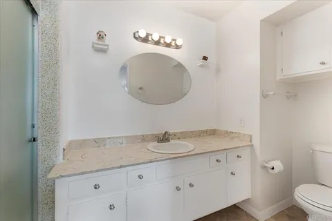 a view of walk in closet with empty shelves