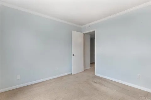 an empty room with a ceiling fan