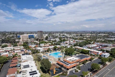 a view of a swimming pool with outdoor seating