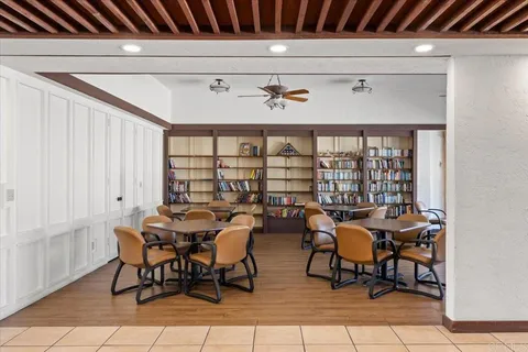 a kitchen with stainless steel appliances granite countertop a refrigerator sink and cabinets