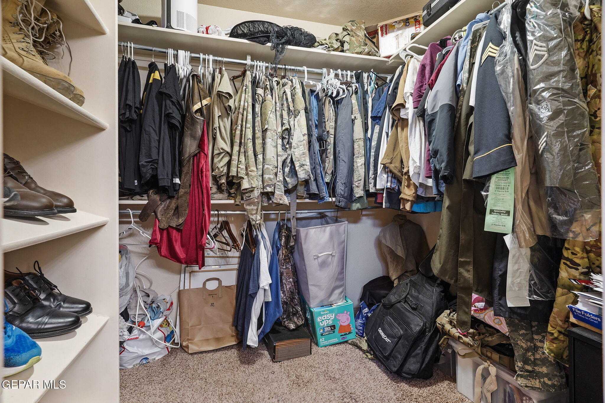3152 Rustic Hidden Drive El Paso, TX 79938 - Photo 27 of 38 a view of walk in closet with clothes