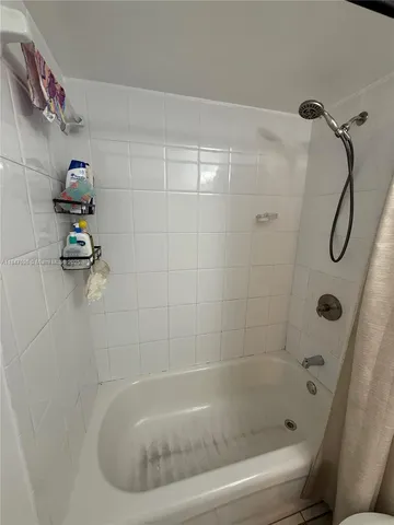 a bathroom with a bath tub